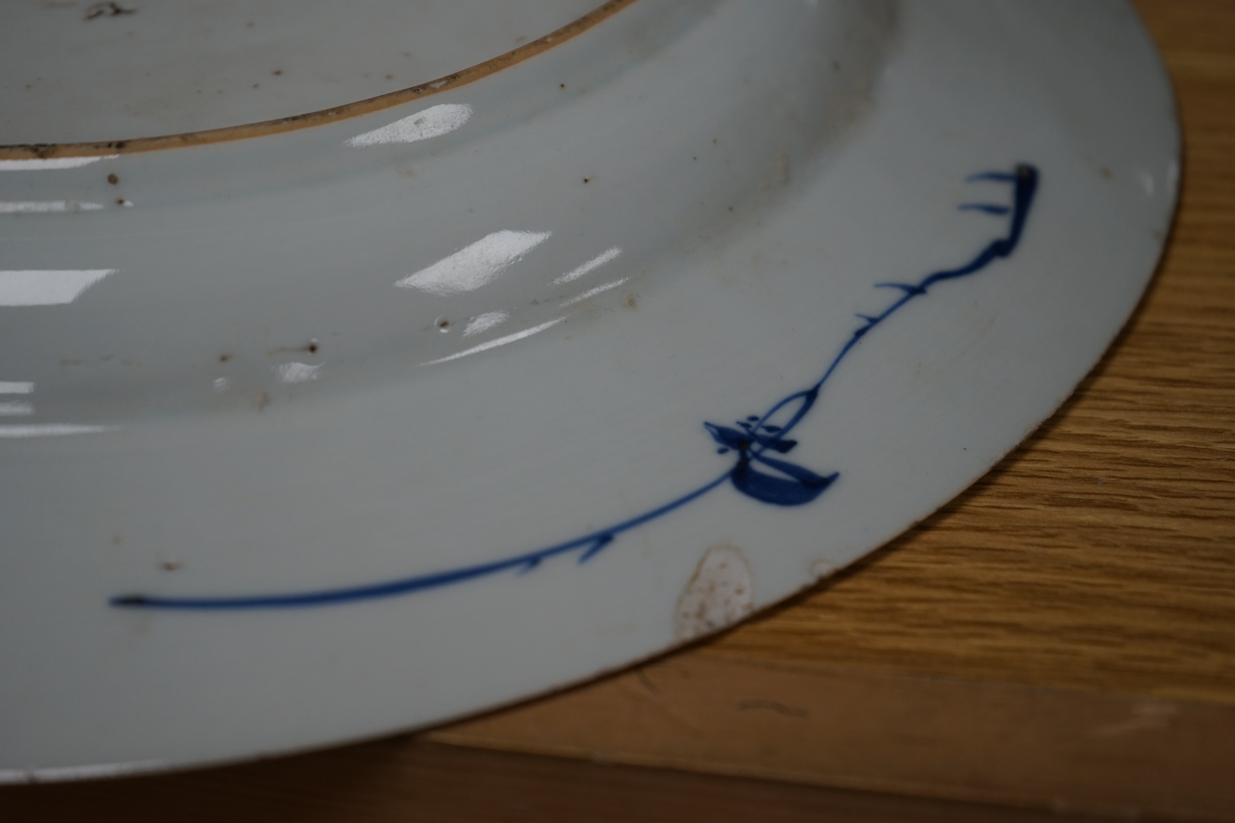 An 18th century Chinese blue and white circular dish decorated with flowering plants, Dia 32.5cm